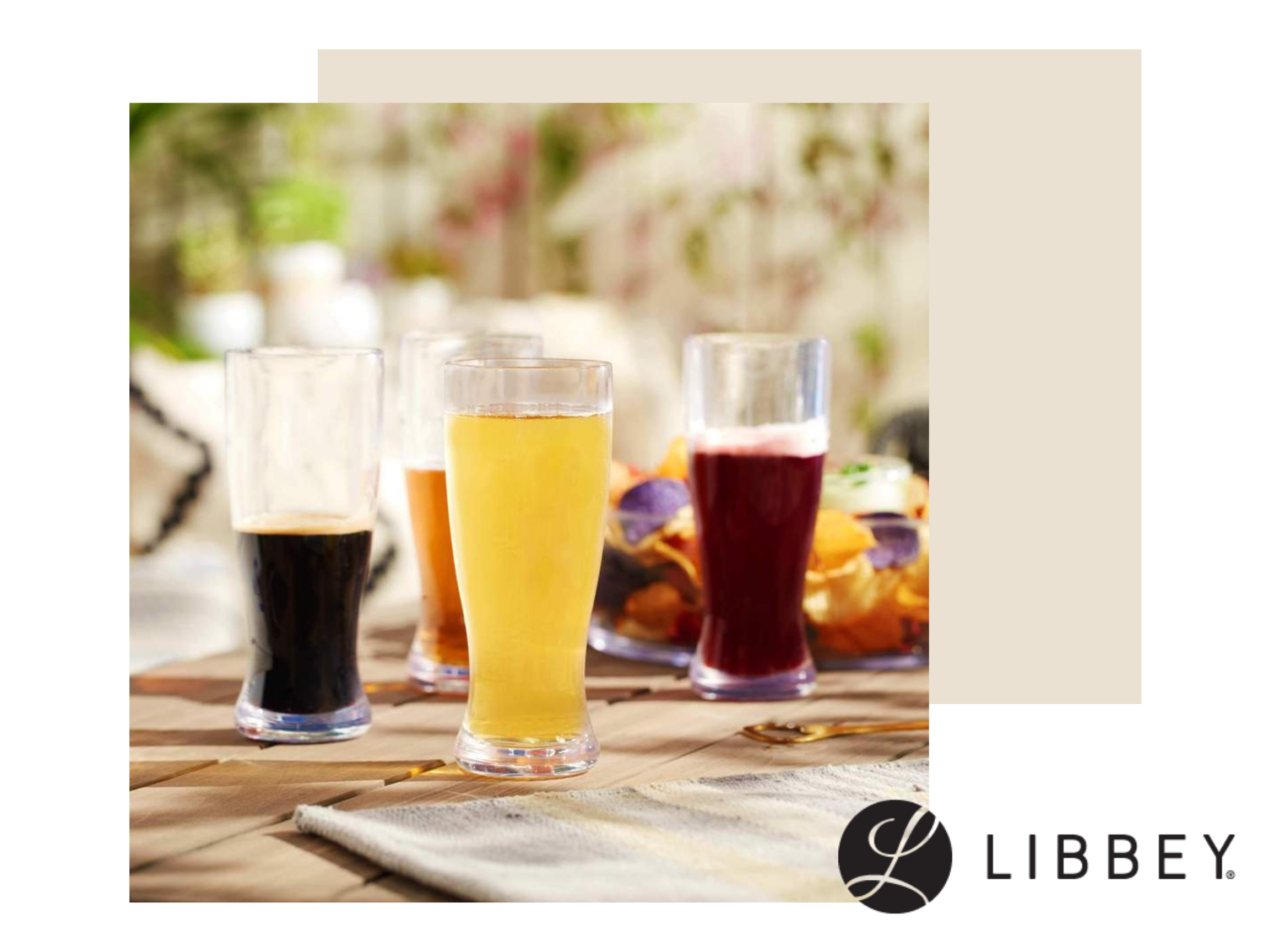 Several Libbey Drinking glasses, such as Libbey 1604 Pilsner Glass, Libbey Mixing Glass 15790 or 15141, Libbey 5121 Whiskey Shot Glass filled with a fruity looking alcohol beverage outdoors